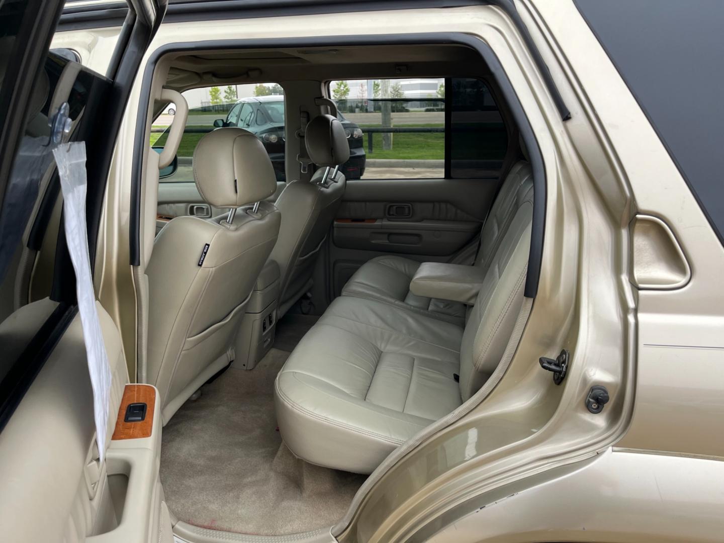 2003 tan /TAN Infiniti QX4 4WD (JNRDR09Y53W) with an 5 engine, 4-Speed Automatic Overdrive transmission, located at 14700 Tomball Parkway 249, Houston, TX, 77086, (281) 444-2200, 29.928619, -95.504074 - Photo#9